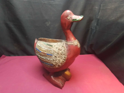 A Lovely heavy wooden Duck with glass decorated. W.19 L.32 H.44 Cm.