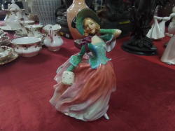 A Royal Doulton Fiqure of Autumn Breezes No. 835666 in Unusual Colors. W.15 H.20 Cm. ( Small crack)