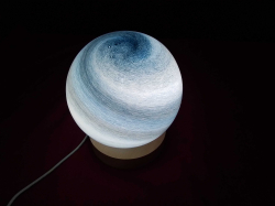 A blue globe table lamp with USB cable. W.14 H.17 Cm.