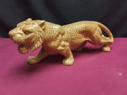 A limited edition high quality porcelain tiger. W.10 L.30 H.12 Cm.