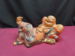 A large Chinese famile rose reclining happy Buddha. W.19 L.30 H.16 Cm.