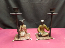 A beautiful couple of Moorish figures seated on mats cold painted bronze candle holders.D.10 W.12 H.21 Cm.