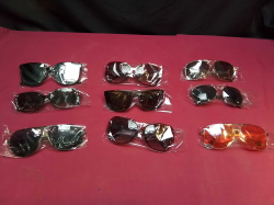 A box of 9 new men and women sunglasses 