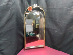 A new brass plated cast iron mirror. 33x72 Cm.