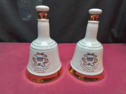 A perfect condition pair of Wade ceramic white &gold whisky decanter sorry no whiskey