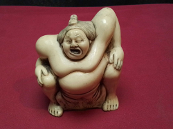 An Antique Japanese Carved Ivory style Netsuke, Figural Depicting A Sumo Wrestler. W.7 H.7 Cm.