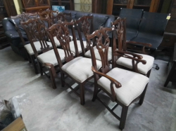 A set of eight chippendale mahogany chairs including 2 carved on square chamfered legs with typical carved backs.