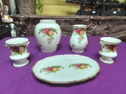 5 Pieces of Old Country Rose pottery including 4 Vases and an oval plate.