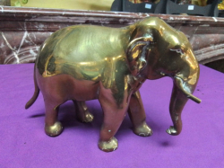 A Large Heavy Brass Model of an Elephant. L.22 H.15 Cm.