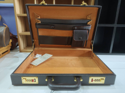 A brand new briefcase cowhide  hard sided attache with combination lock W.31 L.44 Cm.