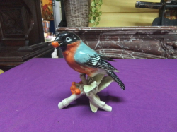 A Lovely large vintage Goebel porcelain model of a Robin Red Breast with a fruit in its beak.  W.11 H.17 Cm.