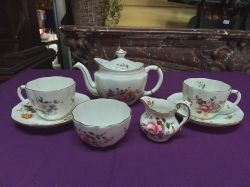 A Royal Crown Derby hand painted tea for 2 service (7 pieces Tea pot, 2 duos, milk and sugar) in Posies Pattern.