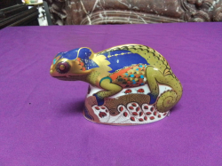 A large and unusual Royal Crown Derby model of a Chameleon with silver stopper. W.5 L.14 H.9 Cm.