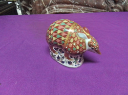 A Royal Crown Derby paper weight with silver stopper extra large size modeled as an armadillo. L.12 H.9 Cm.