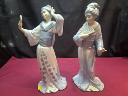 A Pair of LLadro style Spanish figures of Japanese ladies. ( Tinychip to flower on head) W.14cm H.34cm
