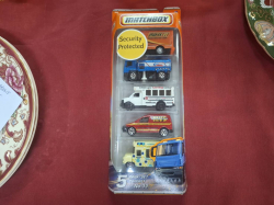 A Set of 5 match box Lorries on original box. Approx box size. H.27 cm W.11cm
