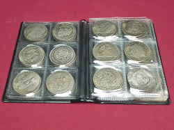 A book of 60 souvenir coins 