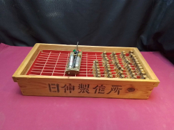A box of vintage 56 lighters with equipment include charger in Wooden box W.22 L.47 H.10 Cm.