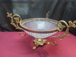 A 19th-century French centerpiece featuring a cut crystal bowl mounted in ornate gilt bronze. W.40 H.26 Cm.