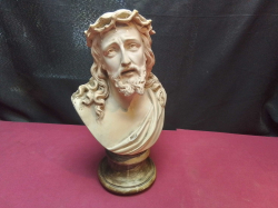 A ceramic sculpture depicting Jesus Christ wearing a crown of thorns. W.18 D.13 H.29 Cm.