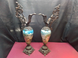 A pair of antique iron and hand painted porcelain 19th century French ewers. W.23 H.60 Cm.