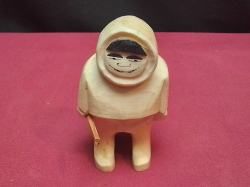 A rare vintage bone carving of an Inuit/Eskimo by acclaimed Norwegian carver Arne Tjomsland.H.8 Cm.