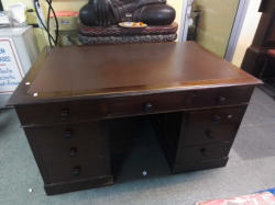 A Top Quality Oak Partners Desk with  Drawer to One side and  Cupboards to the rear. A Very Good  Size in excellent condition an original wooden kniob. W.137 D.92 H.78 Cm.