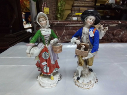 A beautiful Poly Chrome Pair of 19th Century Sitzendorf Figures, of a male rabbit Vendor and a female Companion holding a duck a minor chip to male thumb and rabbit's ear. W.9 H.20 Cm.