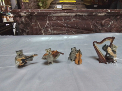 A Small Rare Owl 4 Pieces Owl Band Compising a Cello, a guitar and a violin.