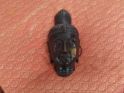 A Matal wall hanging Buddha mask.w.15cm h.30cm
