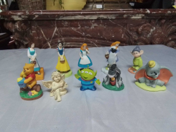 A group of 9 Various Disney Figures.