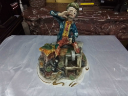 A Large Signed Capodimonte of a man near a Well. W.25 L.28 H.30 Cm. (A/F)