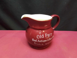 A VINTAGE OLD PARR ANTIQUE SCOTCH WHISKY JUG MACDONALD GREENLEES LTD SCOTLAND 1930(WADE). W.12 D.17 H.13 Cm.