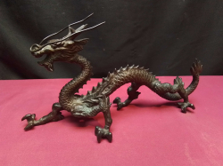  A cast iron dragon. L.29 H.15 Cm.