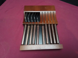 Set of high quality knifes and forks in wooden tray