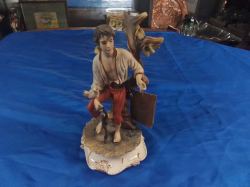 A Capodimonte Figure of a Young man with certificate signed M.dons and crown mark. Size 25 Cm W. 13 c. W.