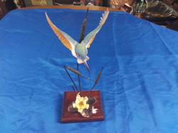A Lovely model of a bird hovering over a Lilly pad. Approx  h.29 cm