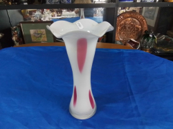 An overlay white glass vase showing various shadet. Size 27x15 cm of red and pink