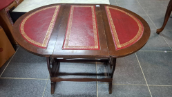 A Small mahogany fozding table with leather insert. All over size 50x62x51.5 cm