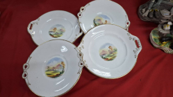 A set of 4 English 19th century hand painted plates with twin handle. W.25 cm