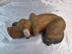 A wooden figure of a dog