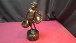 A Very heavy French cast bronze sculpture of a girl holding 2 baskets. On a marble base signed by Susanne Bisard 1873 to 1963. on a Faux Marble base 28 cm high beautiful contions