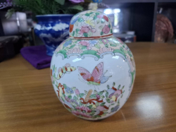 A 19th century Polychrome Ginger jar and lid remark to base. W.13 cm H.16 cm