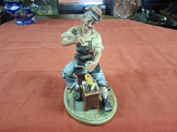A Signed Porcelain Capodimonte figure of a Cobbler. W.13 cm H.22 cm 
