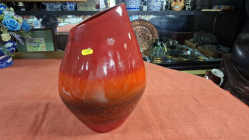 A Large porcelain Vase in various shape of Red. H.37 cm W.24 cm