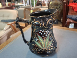A Large and painted lustre jug
H.21 cm.
W.18 cm.