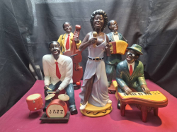 5 Black musicians jazz band 


 Single H.48 W.14.5 cm.
Drummer H.36 W.18 cm.
Cellist H.45 W.18 cm.
Pianist H.32 W20 cm.
Accordionist H.44.5 w.15 cm.