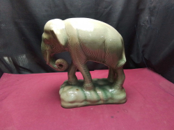 A large celadon glazed elephant