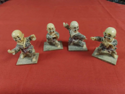 A group of 4 SHAOLIN boy monk Kung Fu figures