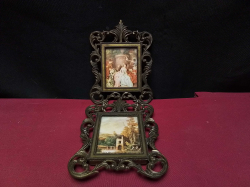 Vintage Italian spelter linked holding picture frames featuring minature art print Interconnected verticak tiered frames with baroque scroll work in florentine Revival style 
H.22cm.
W7.3cm.